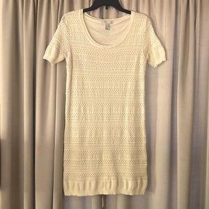 Soft, lined, cream colored knit scoop neck dress.